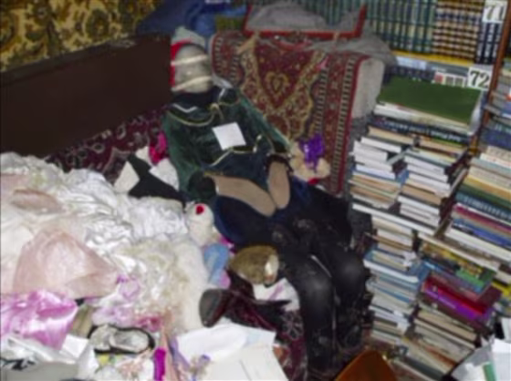 This photo provided by the Russian Interior Ministry's branch in the Nizhny Novgorod region shows a mummified body at an apartment dressed up like a doll taken from a grave at an apartment in Nizhny Novgorod, some 400 kilometers (250 miles) east of Moscow. 